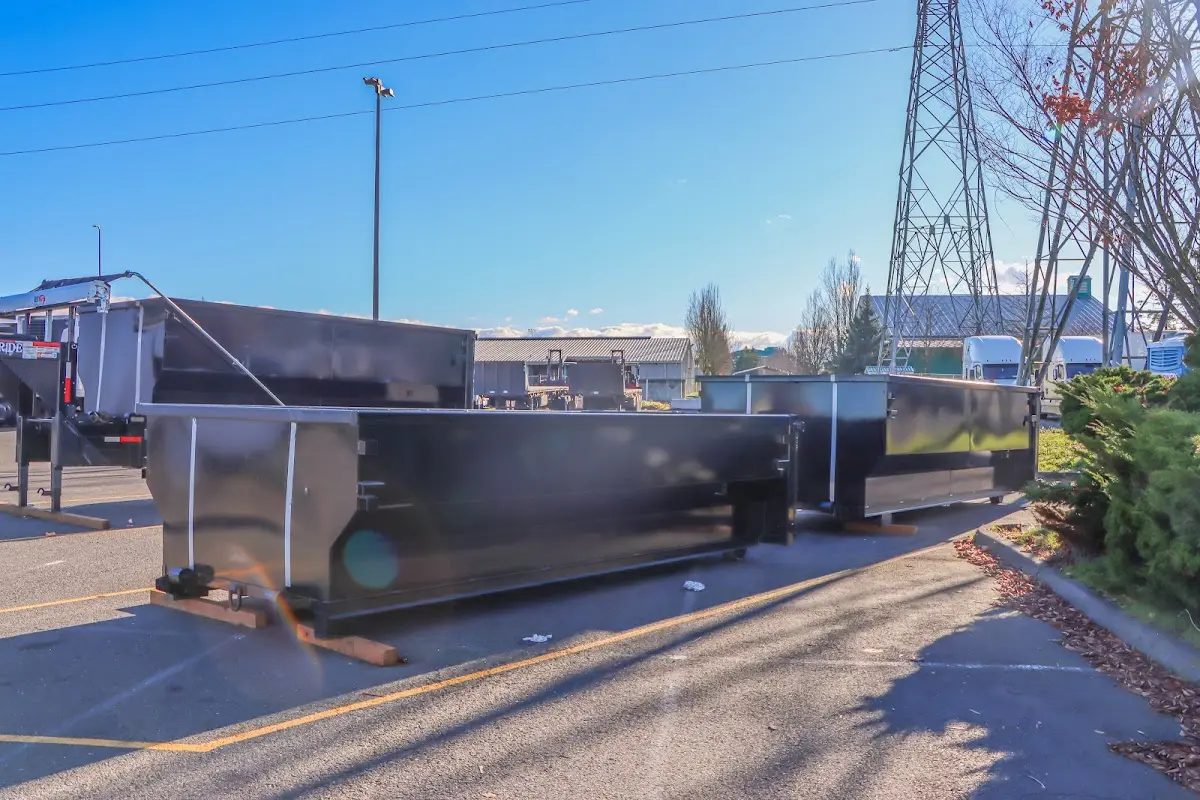 Roll-off dumpster ready for waste disposal at job site for Demolition Dumpster Rental in Youngsville